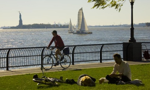 people in a park by a body of water