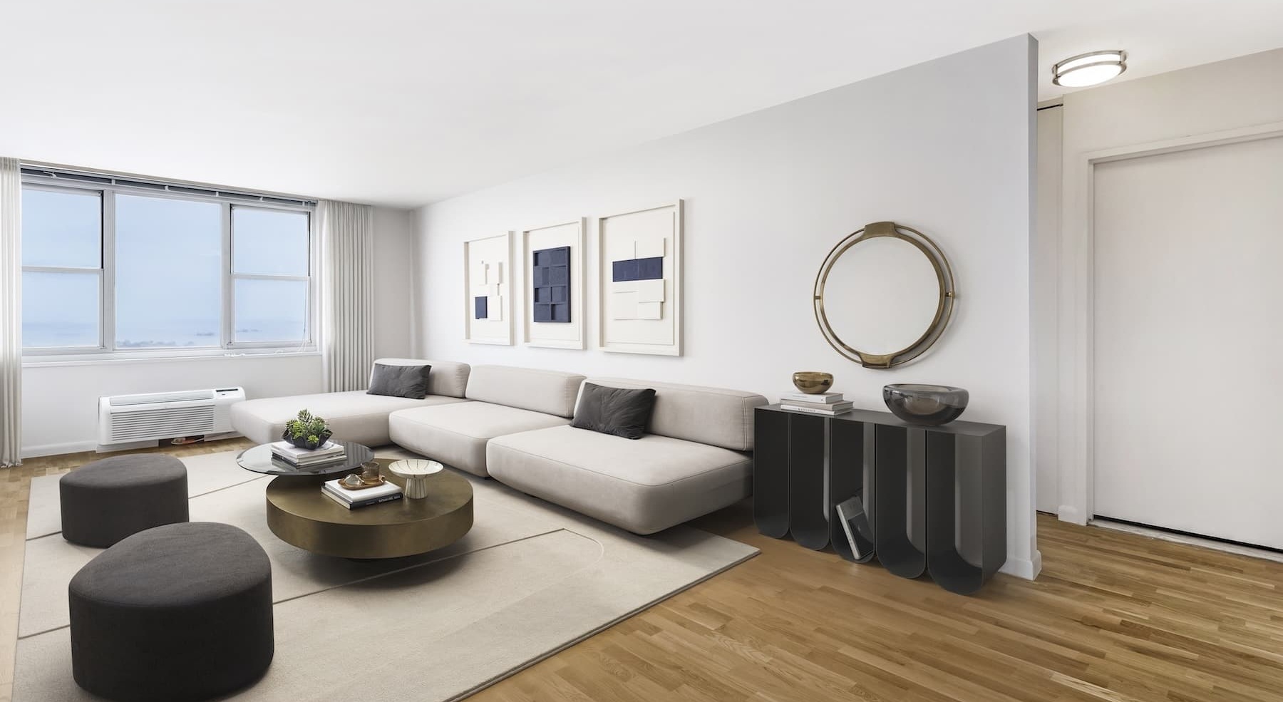 living area with a large couch and bright lighting